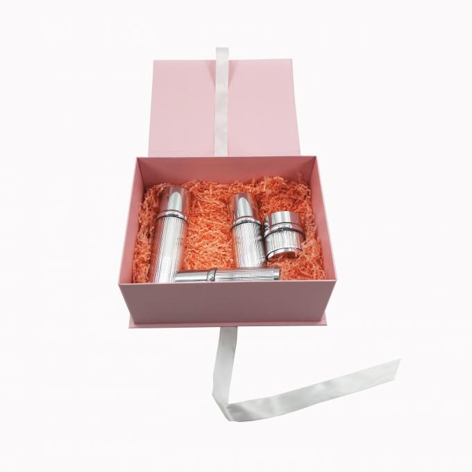スキン ケアのための折り畳み式のギフト用の箱のリボンの閉鎖を包むピンクのボール紙の化粧品