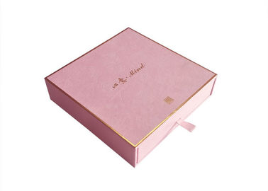 包む化粧品紙箱のピンクの織り目加工のペーパー金ホイルのロゴの耐久財を滑らせます